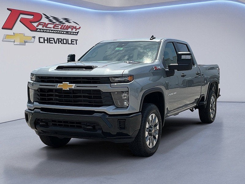2026 Chevrolet Silverado 2500 HD Custom in Sterling Gray Metallic — front three-quarter view