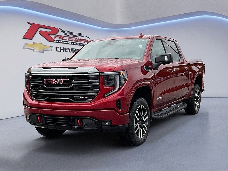 2024 GMC Sierra 1500 AT4 in Volcanic Red Tintcoat — front three-quarter view